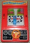 Drive_Yourself_Crazy_by_Tomy,_Model_No._7011,_Powered_by_1__C__Battery,_Made_in_Hong_Kong,_Cop...jpg